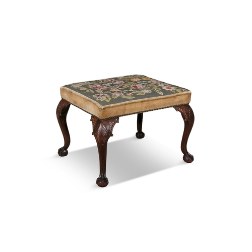 385 - A GEORGE II STYLE CARVED MAHOGANY STOOL,   the rectangular top covered in a 'gros-point' floral tape... 