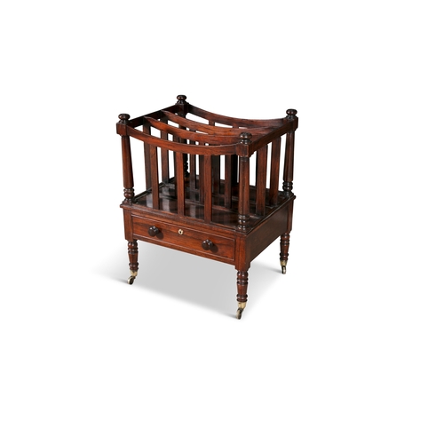 387 - A VICTORIAN MAHOGANY CANTERBURY,   the slatted side with turned pilasters, with single drawer, on tu... 