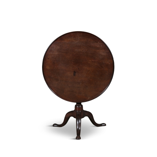 388 - A GEORGE III MAHOGANY TILT-TOP WINE TABLE,   the dished circular top on a turned central baluster co... 