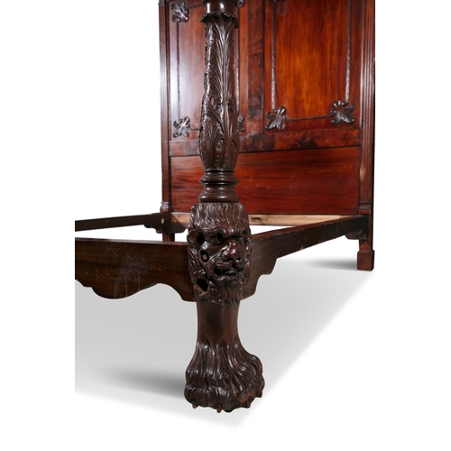 395 - AN IRISH CARVED MAHOGANY FOUR-POSTER BED 18/19TH CENTURY,   the rectangular moulded cornice carved t... 