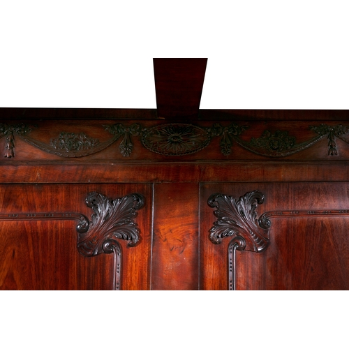 395 - AN IRISH CARVED MAHOGANY FOUR-POSTER BED 18/19TH CENTURY,   the rectangular moulded cornice carved t... 