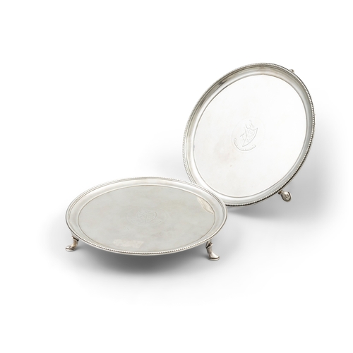 400 - A PAIR OF GEORGE III IRISH SILVER CIRCULAR SALVERS,  Dublin c.1785, mark of John Lloyd, with raised ... 