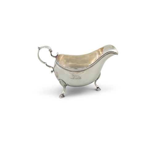 402 - A GEORGE III IRISH SILVER OVAL SAUCE BOAT,  Dublin c.1780, mark of Matthew Walsh, with fine beaded r... 