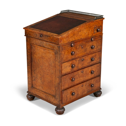 424A - A GEORGE IV POLLARD OAK DAVENPORT DESK IN THE MANNER OF GILLOWS,  the hinged top with shallow brass ... 