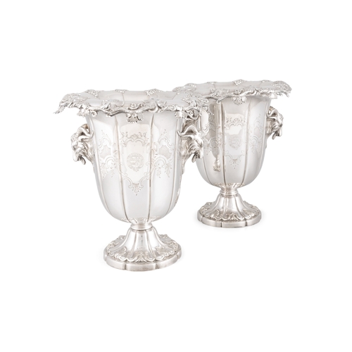 453 - A FINE PAIR OF SILVER PLATED WINE COOLERS WITH RAM'S HEAD TWIN HANDLES,   of campagna form, each wit... 