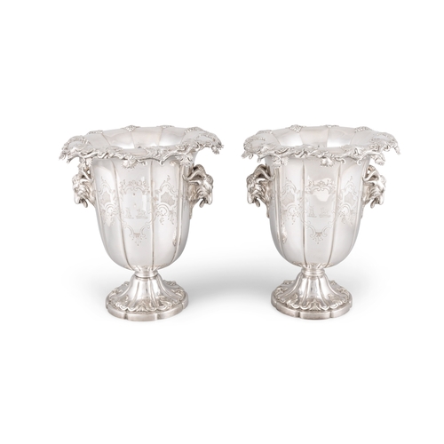 453 - A FINE PAIR OF SILVER PLATED WINE COOLERS WITH RAM'S HEAD TWIN HANDLES,   of campagna form, each wit... 