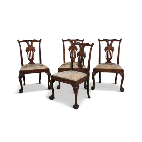 463 - A SET OF FOUR GEORGE III CARVED MAHOGANY SIDE CHAIRS,   each with shaped top rail above an openwork ... 