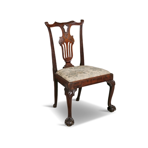 463 - A SET OF FOUR GEORGE III CARVED MAHOGANY SIDE CHAIRS,   each with shaped top rail above an openwork ... 