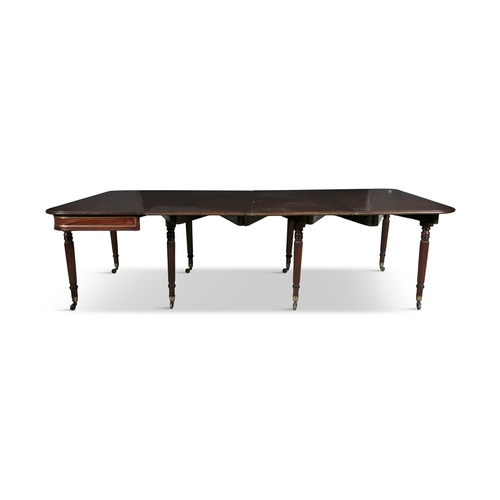 467 - AN UNUSUAL REGENCY ROSEWOOD CONCERTINA ACTION EXTENDING DINING TABLE,   of rectangular shape with ro... 