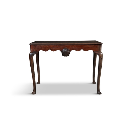 480A - AN IRISH GEORGE III MAHOGANY SIDE TABLE,  thumb moulded rim with shell carved frieze on cabriole leg... 