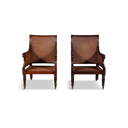 486 - A PAIR OF GEORGE IV MAHOGANY AND CANEWORK BERGÈRES WITH REEDED FRAMES,   cane back and seat on flute... 