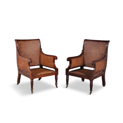 486 - A PAIR OF GEORGE IV MAHOGANY AND CANEWORK BERGÈRES WITH REEDED FRAMES,   cane back and seat on flute... 