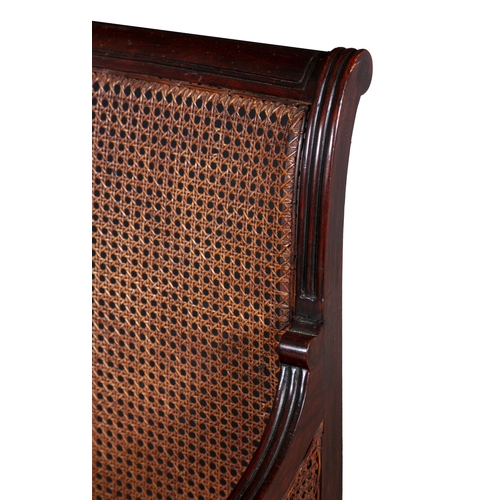 486 - A PAIR OF GEORGE IV MAHOGANY AND CANEWORK BERGÈRES WITH REEDED FRAMES,   cane back and seat on flute... 