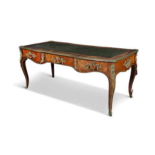 494 - A LOUIS XV STYLE ORMOLU-MOUNTED KINGWOOD BUREAU PLAT 19TH CENTURY,   the shaped rectangular top with... 