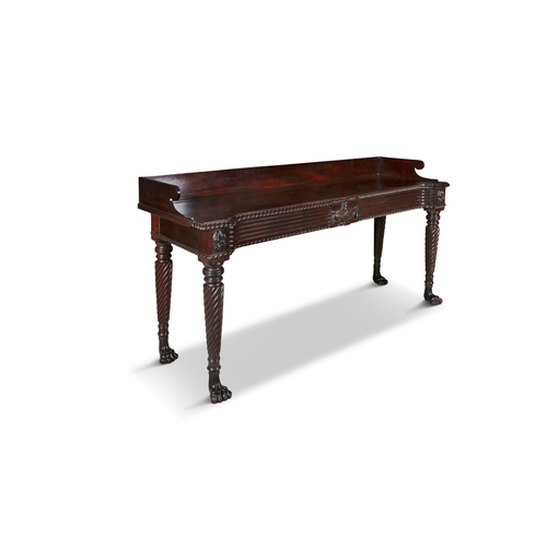 496 - AN IRISH REGENCY CARVED MAHOGANY SERVING TABLE CORK CIRCA 1815,   of rectangular form, the breakfron... 