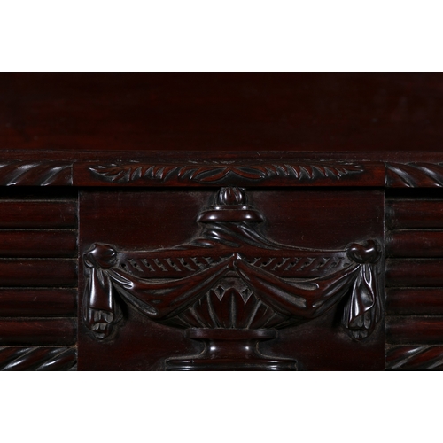 496 - AN IRISH REGENCY CARVED MAHOGANY SERVING TABLE CORK CIRCA 1815,   of rectangular form, the breakfron... 