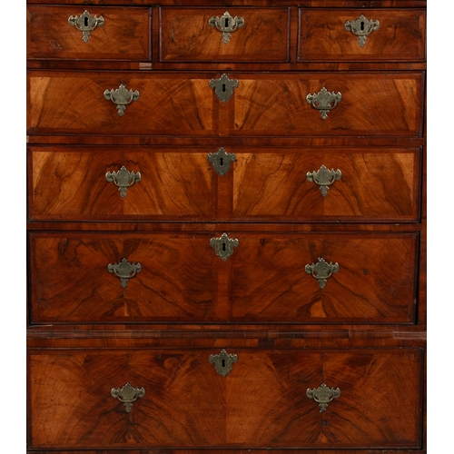 517 - A GEORGE II OAK AND WALNUT CHEST ON STAND EARLY 18TH CENTURY  fitted with cavetto cornice above a ro... 