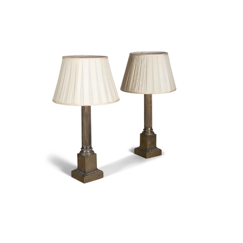 535 - A PAIR OF LARGE BRASS COLUMN TABLE LAMPS,  the top of each column cast with leaf decoration, above f... 