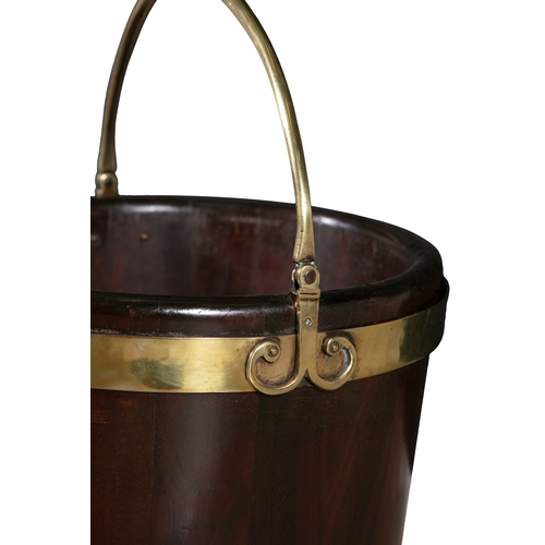 541 - A GEORGE III MAHOGANY AND BRASS BOUND PLATE BUCKET,  of circular tapering design with swing handle, ... 