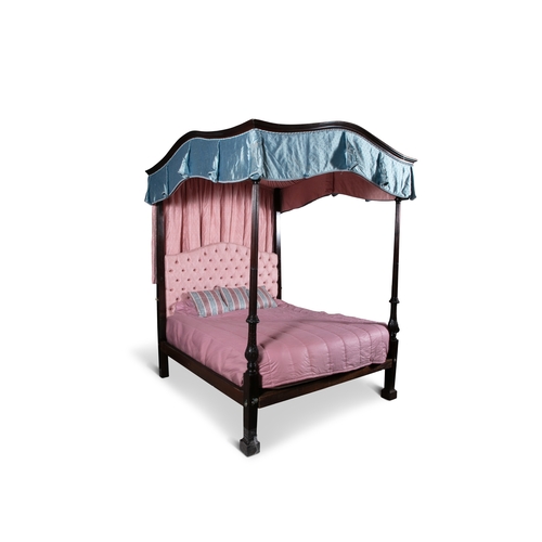 559 - A GEORGE III STYLE MAHOGANY FOUR-POSTER BED,  with mahogany stop-fluted and foliate carved posts on ... 