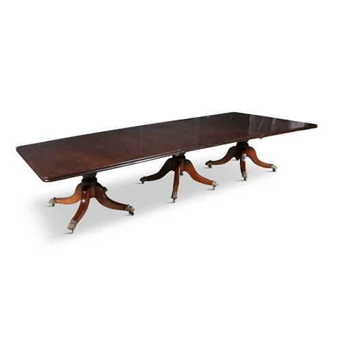 565 - A FINE IRISH WILLIAM IV MAHOGANY TRIPLE PILLAR EXTENDING DINING TABLE  the solid panel top with moul... 