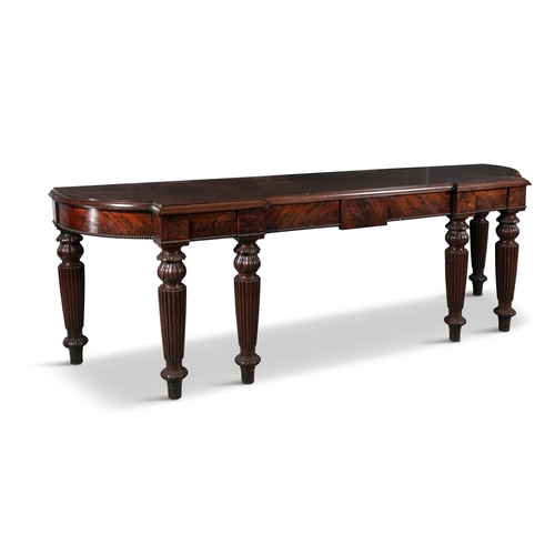 569 - A LARGE IRISH REGENCY BREAKFRONT SERVING TABLE IN THE MANNER OF GILLINGTONS DUBLIN,  the shaped top ... 