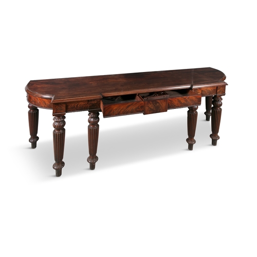 569 - A LARGE IRISH REGENCY BREAKFRONT SERVING TABLE IN THE MANNER OF GILLINGTONS DUBLIN,  the shaped top ... 