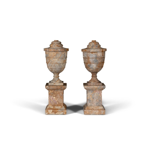 575 - A PAIR OF CONTINENTAL MARBLE URNS AND COVERS ON PEDESTAL BASES EARLY 20TH CENTURY,  51.5cm high