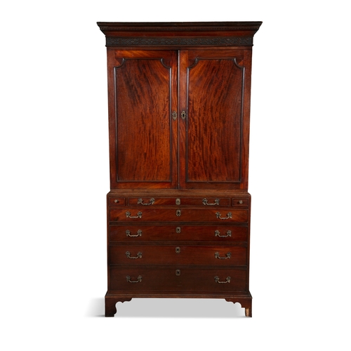 577 - AN IRISH GEORGE III SECRETAIRE BOOKCASE,  the rectangular two door top surmounted with a blind fretw... 