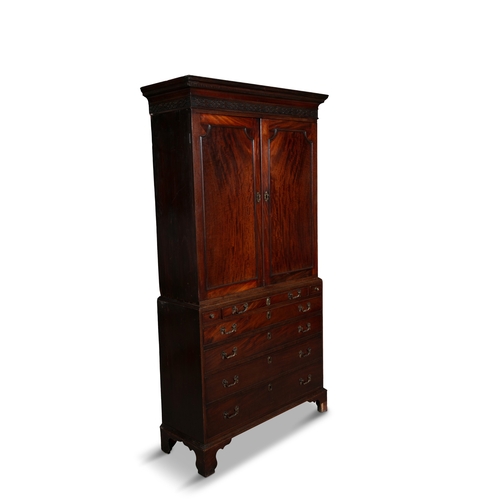 577 - AN IRISH GEORGE III SECRETAIRE BOOKCASE,  the rectangular two door top surmounted with a blind fretw... 