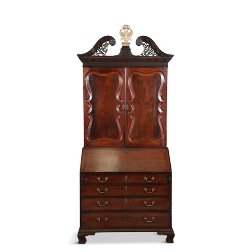 589 - AN IRISH GEORGE II MAHOGANY BUREAU BOOKCASE CIRCA 1740,   the broken swan neck pediment with pierced... 