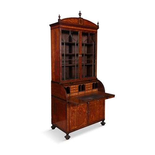 593 - A GEORGE III SATINWOOD CYLINDER BUREAU BOOKCASE,  with arched pediment and turned finials above twin... 