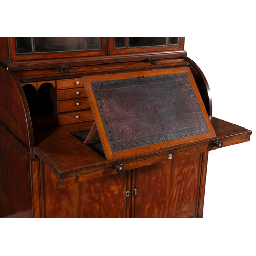 593 - A GEORGE III SATINWOOD CYLINDER BUREAU BOOKCASE,  with arched pediment and turned finials above twin... 