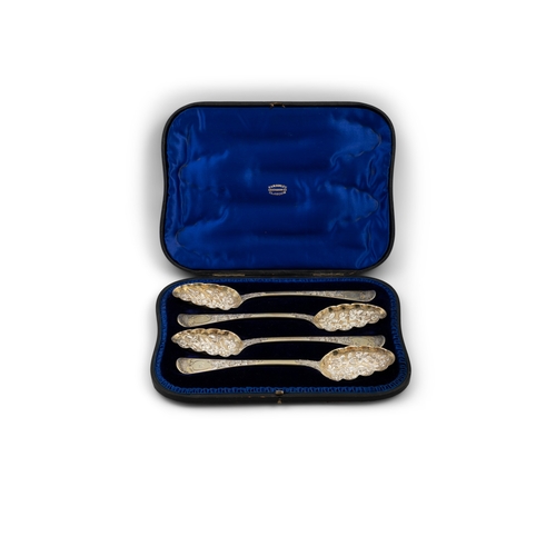 597 - A SET OF FOUR GEORGE IV SILVER GILT BERRY SPOONS,  London 1827, mark possibly that of William Chawne... 