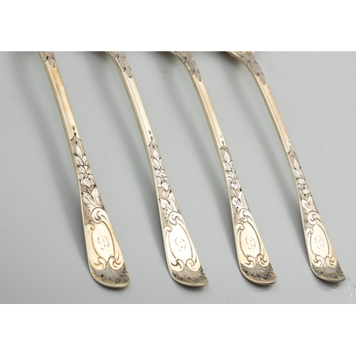 597 - A SET OF FOUR GEORGE IV SILVER GILT BERRY SPOONS,  London 1827, mark possibly that of William Chawne... 