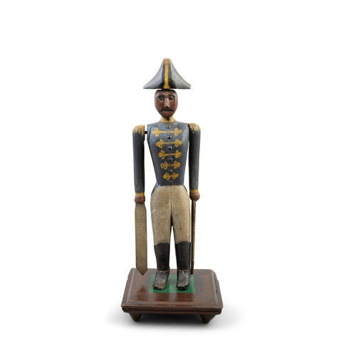 605A - A CARVED AND POLYCHROME TIMBER NAPOLEON WHIRLIGIG, 19TH CENTURY  modelled in uniform with tricorn ha... 