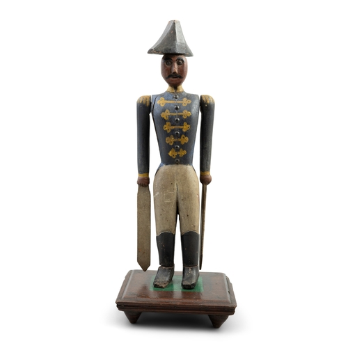 605A - A CARVED AND POLYCHROME TIMBER NAPOLEON WHIRLIGIG, 19TH CENTURY  modelled in uniform with tricorn ha... 