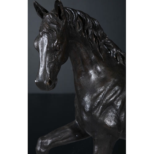 619 - A LARGE STRIDING BRONZE HORSE  68cm high, 90cm long