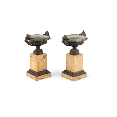 626 - A PAIR OF BRONZE CAMPAGNA URNS ON SIENNA MARBLE PLINTH BASES. 33cm high, 27cm wide, 20cm diameter