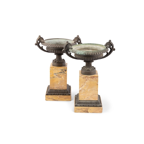 626 - A PAIR OF BRONZE CAMPAGNA URNS ON SIENNA MARBLE PLINTH BASES. 33cm high, 27cm wide, 20cm diameter