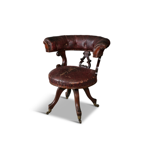 638 - A VICTORIAN MAHOGANY FRAMED SWIVEL ACTION LIBRARY CHAIR,  with stuffed tub shaped back and pierced v... 