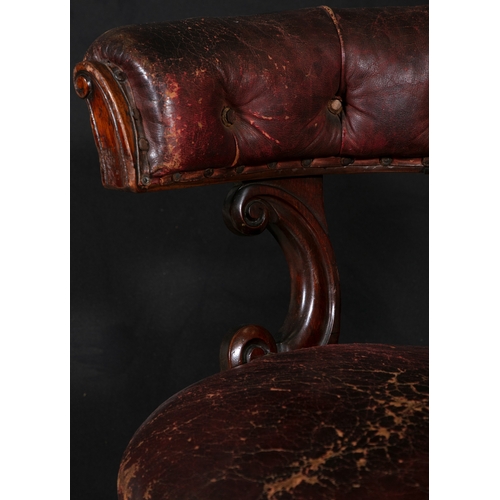 638 - A VICTORIAN MAHOGANY FRAMED SWIVEL ACTION LIBRARY CHAIR,  with stuffed tub shaped back and pierced v... 