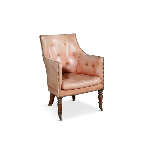 643 - A GEORGE IV LEATHER UPHOLSTERED TUB BACK CHAIR   covered in faded tan hide with loose cushion raised... 