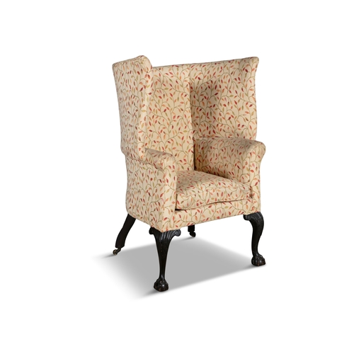 645 - A GEORGE III MAHOGANY TUB BACK UPHOLSTERED ARMCHAIR,   with padded back, scroll arms and squab cushi... 