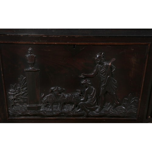 660 - A GEORGE IV MAHOGANY CELLERETTE  of sarcophagus form, the lid surmounted with carved flower head and... 