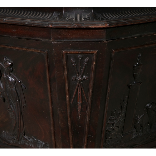 660 - A GEORGE IV MAHOGANY CELLERETTE  of sarcophagus form, the lid surmounted with carved flower head and... 