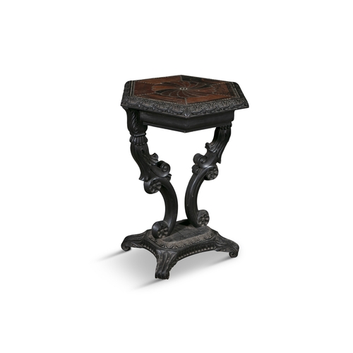 675 - A CEYLONESE EBONY AND SPECIMEN WOOD HEXAGONAL OCCASIONAL TABLE 19TH CENTURY  the top with spiral inl... 