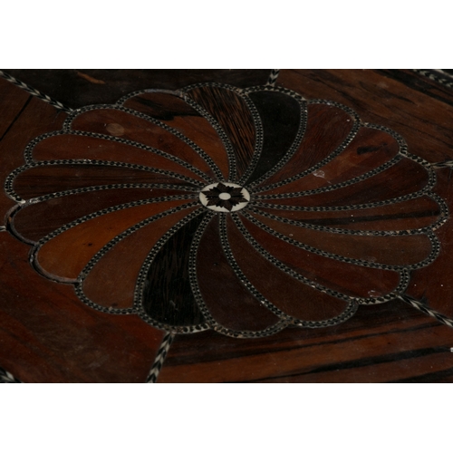 675 - A CEYLONESE EBONY AND SPECIMEN WOOD HEXAGONAL OCCASIONAL TABLE 19TH CENTURY  the top with spiral inl... 