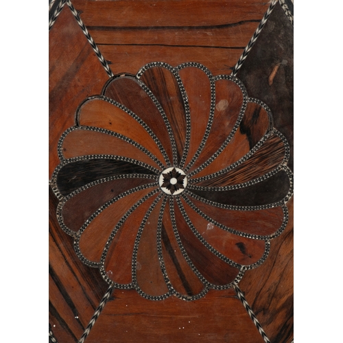 675 - A CEYLONESE EBONY AND SPECIMEN WOOD HEXAGONAL OCCASIONAL TABLE 19TH CENTURY  the top with spiral inl... 