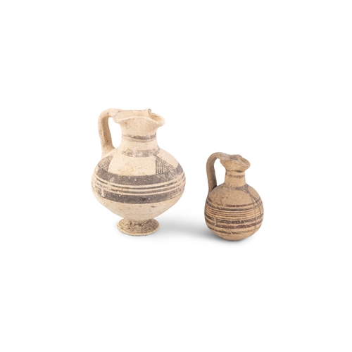 685 - TWO ANCIENT CYPRIOT BIOCHROME POTTERY JUGS, Iron Age, c. 1,000 - 500 BC, each of similar shape, with... 